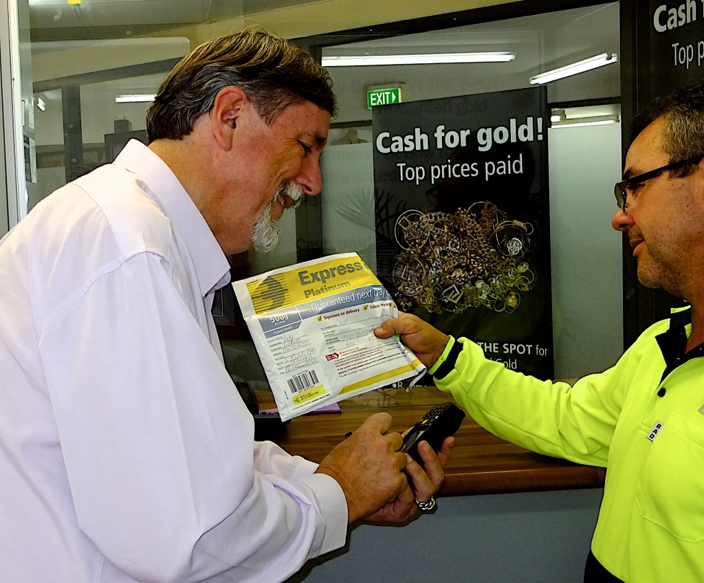 Ivars signing for and receiving Postsafe pack from Australia Post courier.